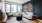 Living room with large three pane window and blue accent wall